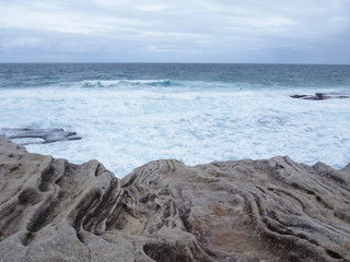 Fototapeta na wymiar cliff and sea waves