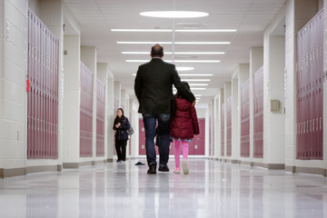 people walking in corridor