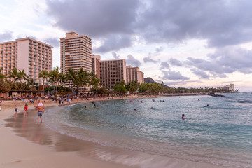 Famous Waikiki Beach at sunset in Honolulu, Hawaii