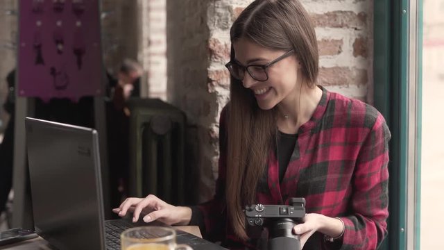 Woman creator smiling while working on the go