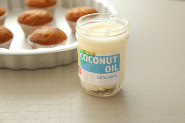 Jar of coconut oil on table