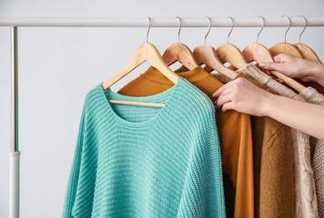 Woman choosing clothes in dressing room