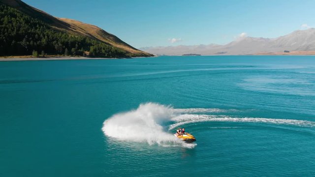 SLOWMO - Jet Ski on Beautiful Turquoise Blue Water - Lake Tekapo, New Zealand - Aerial