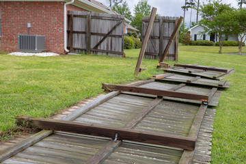 Fence blown down and damaged during storm