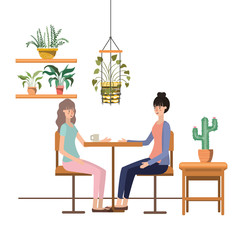 women drinking coffee in the living room