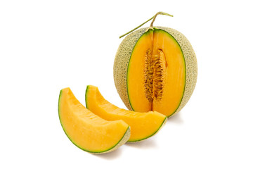 Closeup melon bright colors that is turned and pieces isolated on white background.