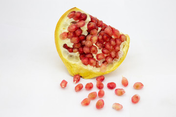 Closeup of fresh pomegranate isolated on white background