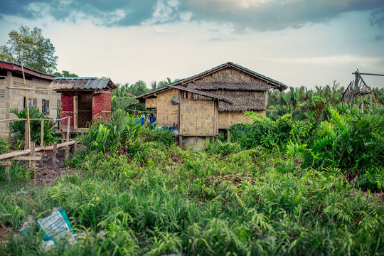 The background of a wooden house in the country (Myanmar village) where tourists can take pictures in public while traveling, surrounded by mountains,mangroves,trees,fresh air
