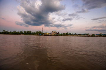 Twilight evening background, blurred blur from a small passenger boat with waves of water and winds (ferries), a natural beauty during an adventurous journey.