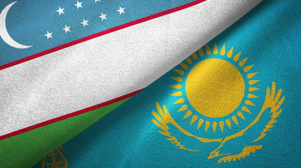 Uzbekistan and Kazakhstan two flags textile cloth, fabric texture