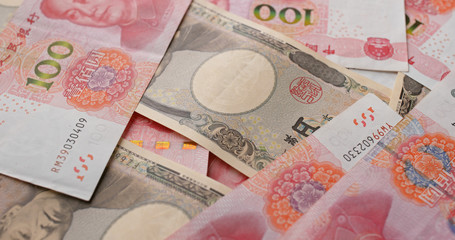 Chinese RMB and Japanese Yen banknote