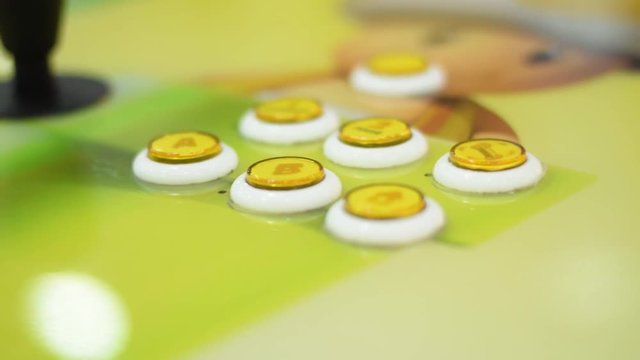 Closeup of yellow arcade console vintage game