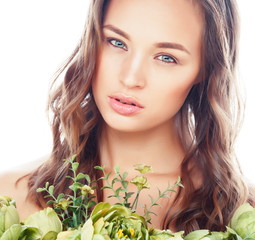 Naklejka premium young pretty woman with fresh green flowers nude makeup, natural fashion concept close up isolated