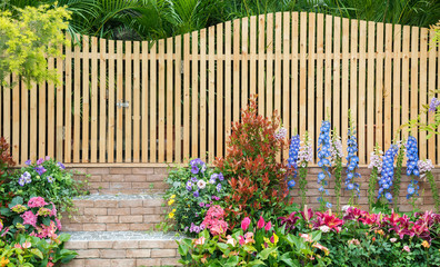 entrance and wooden fence of backyard flower garden - 263815542