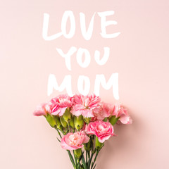 top view of carnation on pink for mothers day