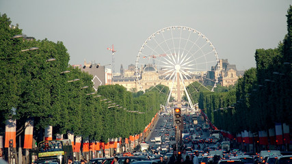Paris, France - circa May, 2017: Traffic on Avenues des Champs Elysees. The Champs-Elysees forms...