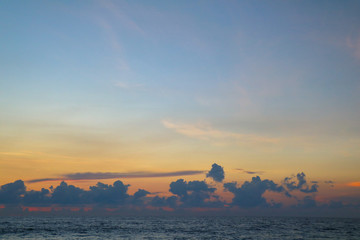Ocean sunset with clouds, sunrise in the sea