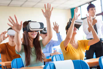 students having fun with new technology vr headset in classroom - obrazy, fototapety, plakaty