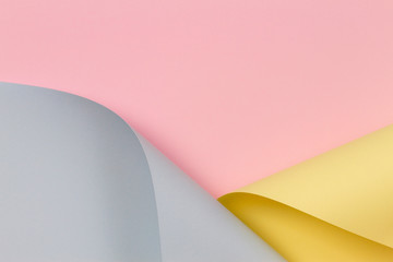 Abstract background. Pastel pink, yellow, blue color paper in geometric shapes