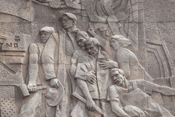 Fototapeta na wymiar stone carving wall art of the 60' era in Shanghai,China.