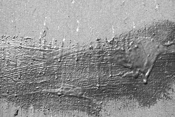 Old painted wall background texture close up. Black and white