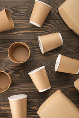 Biodegradable tableware on wooden background. Environmental protection. Secondary processing. The concept of zero waste.