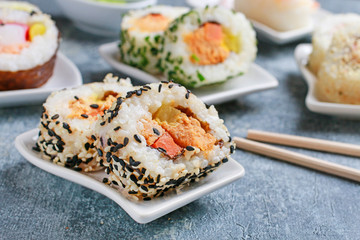 Sushi set on grey stone background.