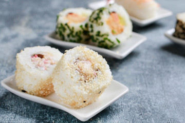 Sushi set on grey stone background.