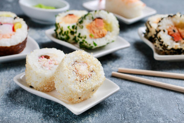 Sushi set on grey stone background.