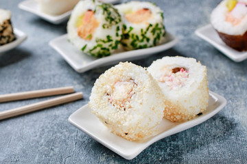 Sushi set on grey stone background.