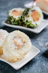 Sushi set on grey stone background.