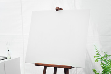 empty canvas board in white room