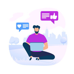 Young Bearded Man Sitting on Ground with Laptop