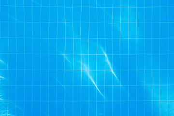 Blue clear water in swimming pool.