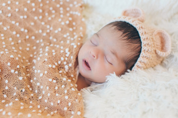 newborn baby in a hat with ears