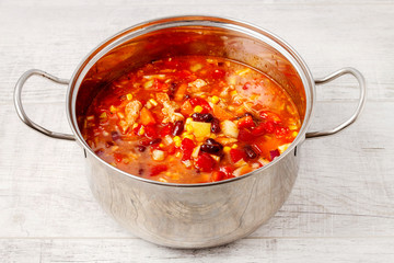 Silver pot with goulash soup.
