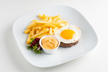 cutlet with egg and french fries