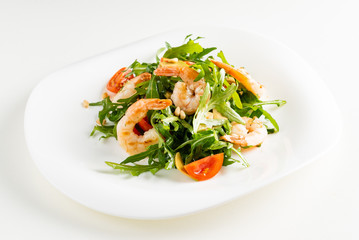 salad with shrimps, rocket salad and cherry tomatoes