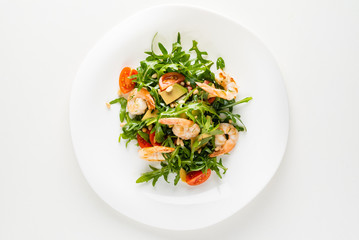 salad with shrimps, rocket salad and cherry tomatoes