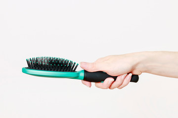 Fototapeta premium Woman holding hairbrush.