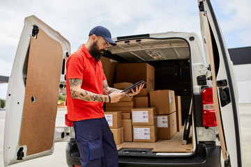 Delivery man checking the list before delivering.