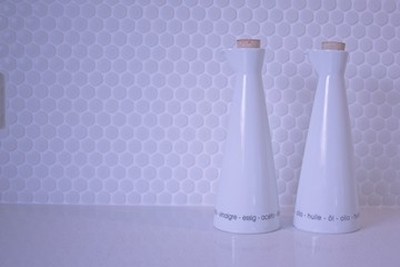 White vinegar and oil bottle on the kitchen counter