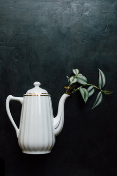 Vintage tea pot on dark background