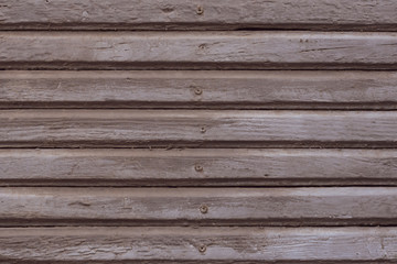 Obraz premium Light brown and grey wood texture background. Gray painted wooden planks with nails. Shabby light brown wooden fence boards. Vintage wood pattern background. Brown retro rough texture. 