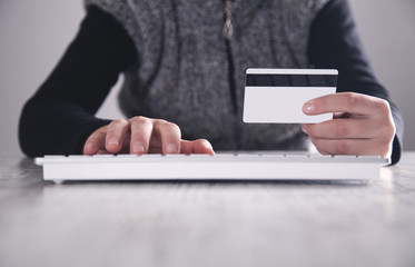 Hand holding credit card. Online shopping