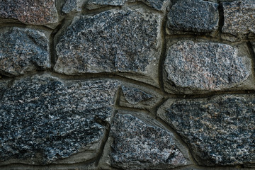 Dark stone wall texture. Stone wall background. Dark rock pattern texture. Granite pattern of natural background.