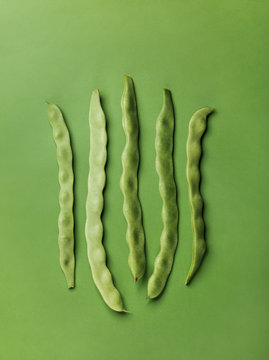 Green pea pods in minimalist arrangement