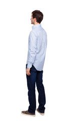 Fototapeta premium Back view of man in dark jeans. Standing young guy.