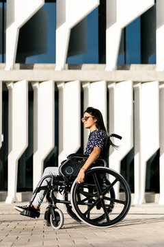 Woman with black hair on wheelchair