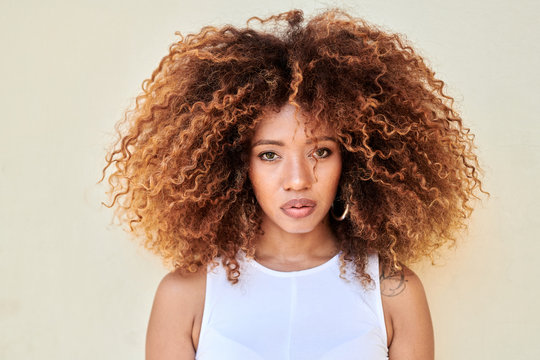 Portrait of beautiful girl with frizzy hair.